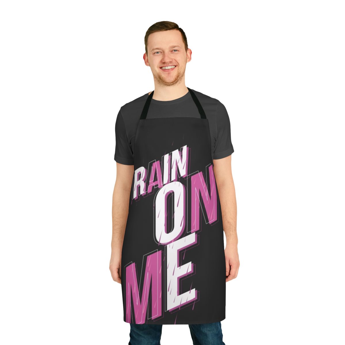 A pink apron with the phrase "Rain On Me" printed on it, inspired by the hit song from Lady Gaga's album Chromatica.