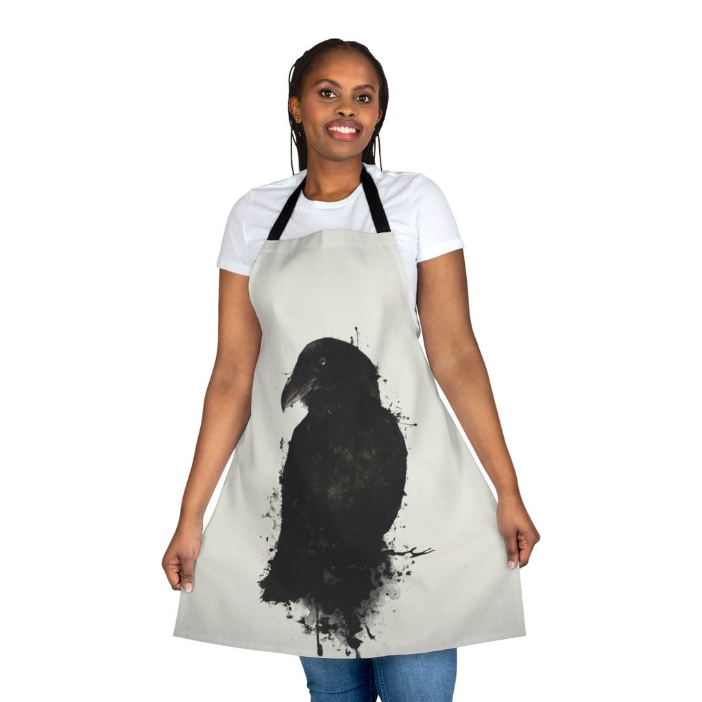 A raven-themed apron with a photomanipulated design featuring ink splatters and bird imagery