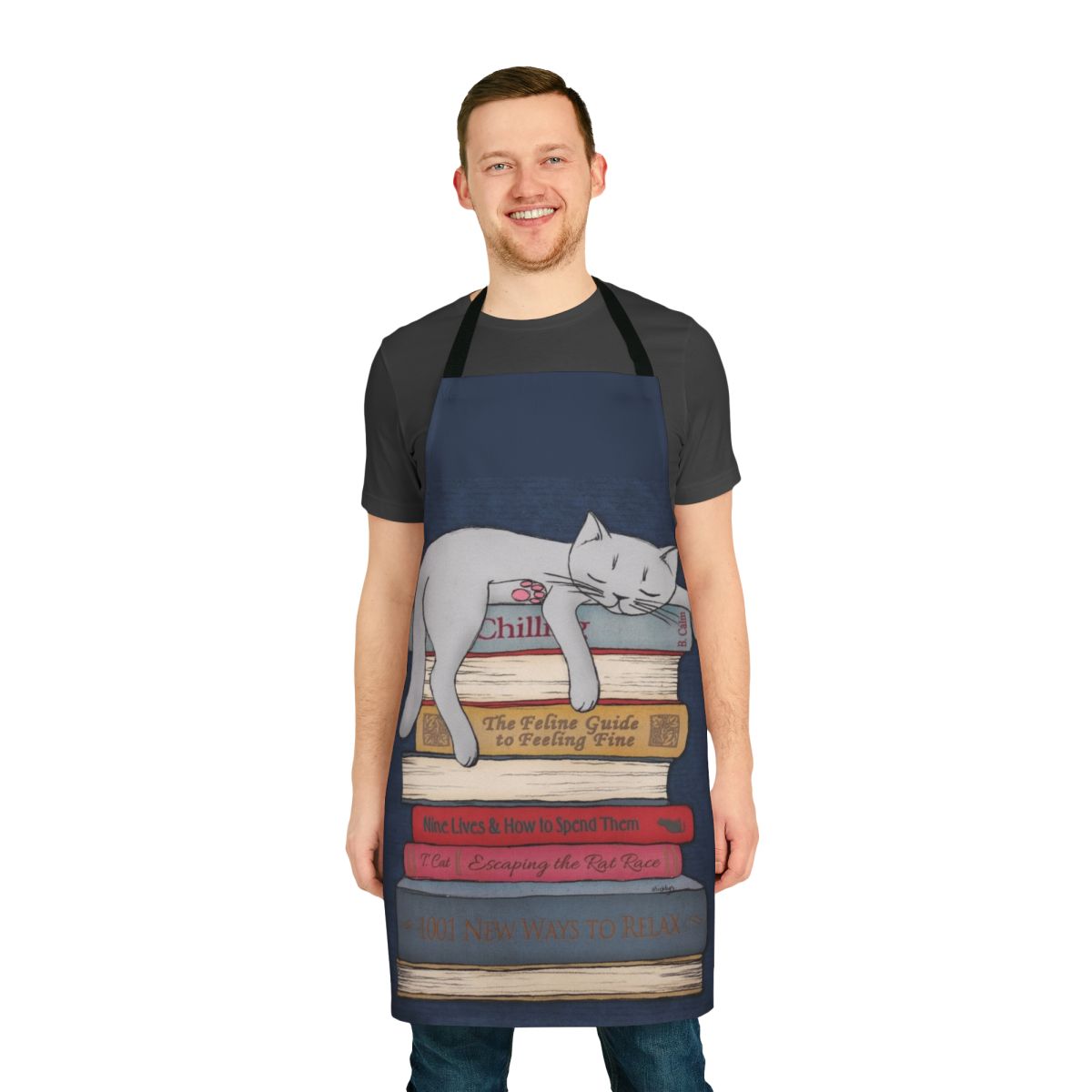 A grey apron with a cat sleeping design in blue and gold tones