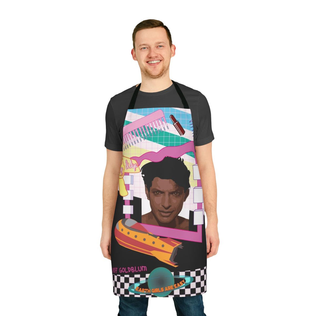 Colorful retro-style apron featuring illustrations of aliens, a spaceship, and a nod to the 1980s film "Earth Girls Are Easy"