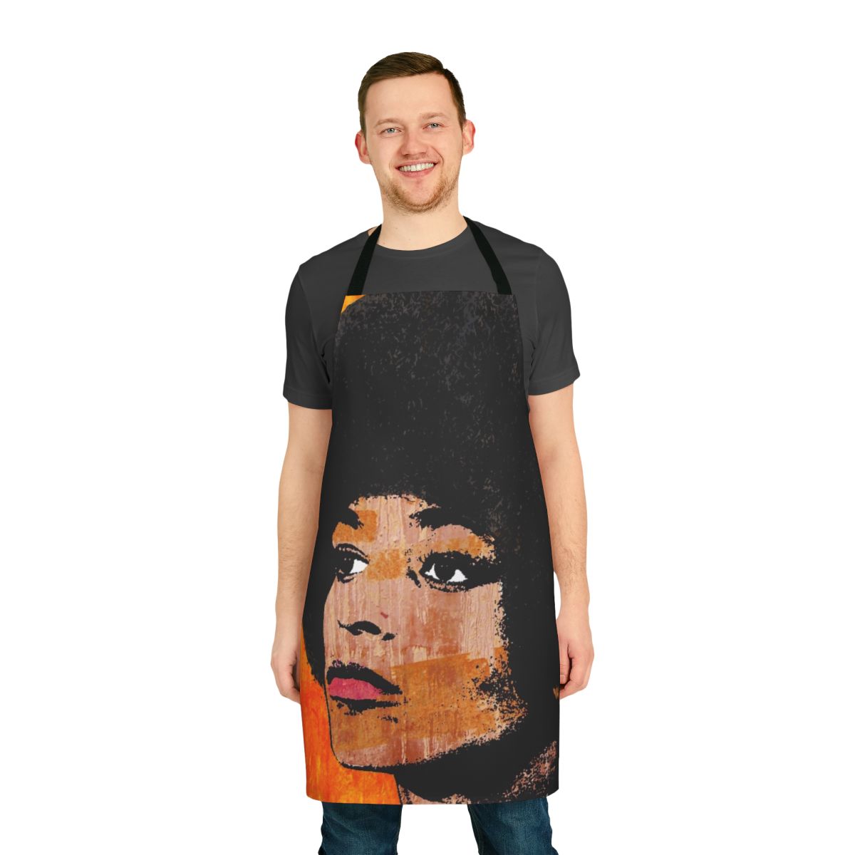A colorful kitchen apron featuring a retro-style portrait of activist Angela Davis