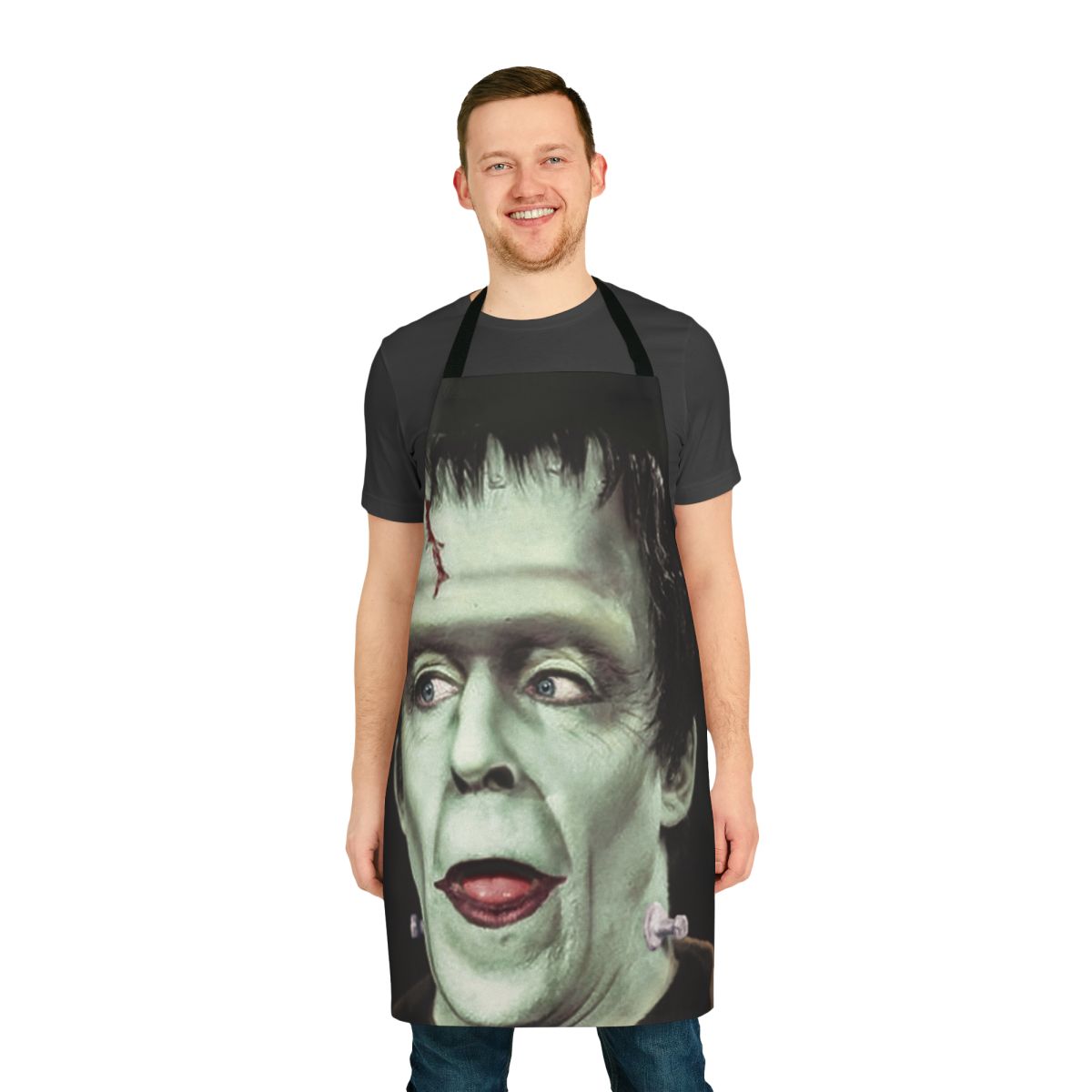A colorful apron featuring a portrait of Herman Munster, the friendly Frankenstein-like character from the 1960s TV series The Munsters.