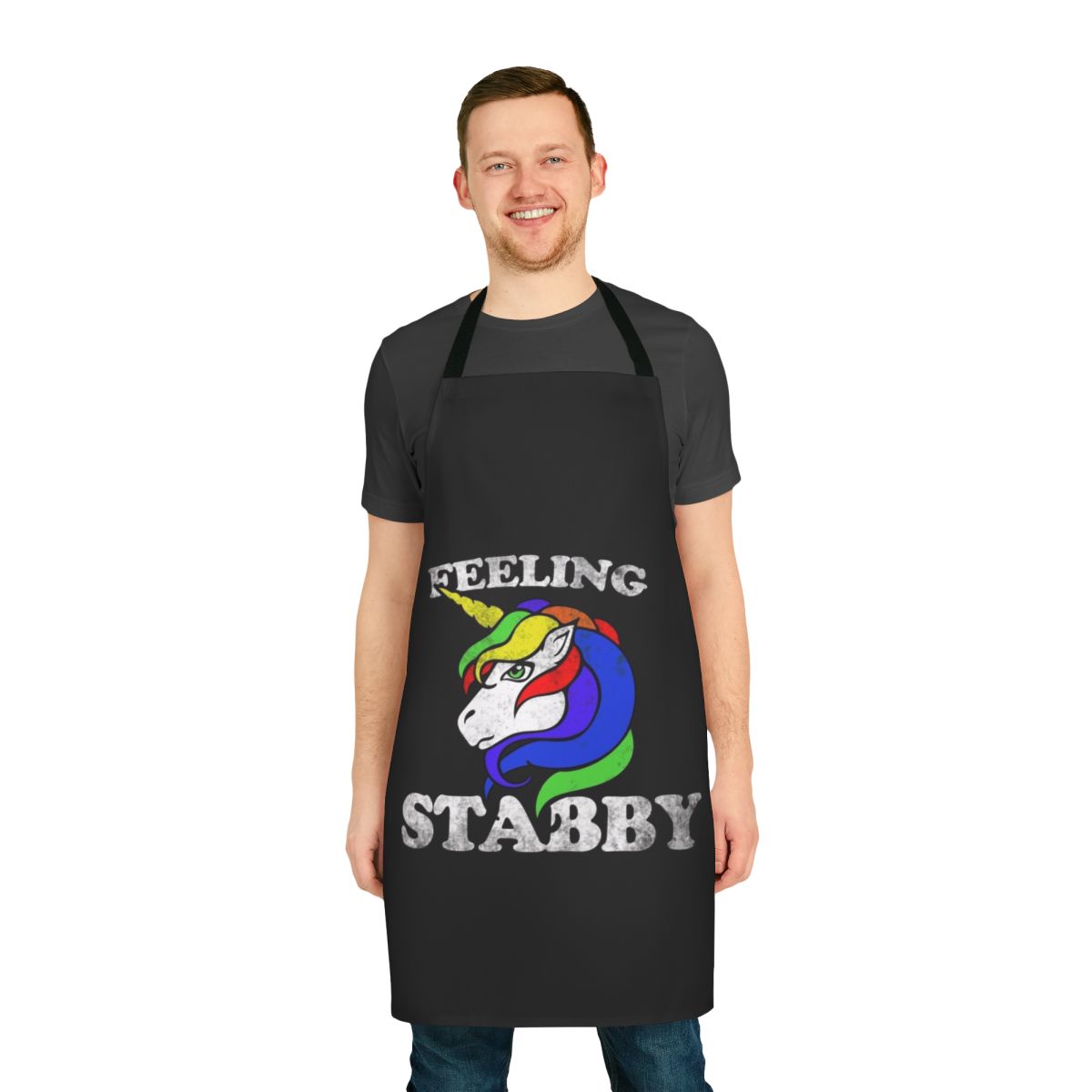 Retro-style unicorn apron with a "Feeling Stabby" design in rainbow colors