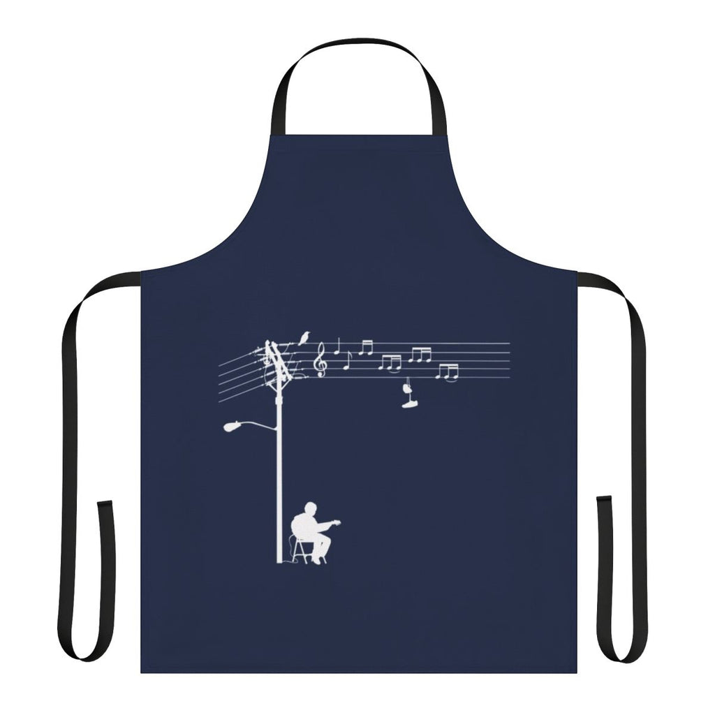 A white apron with a retro, funky design featuring musical elements like wires, sheet music, and a treble clef.