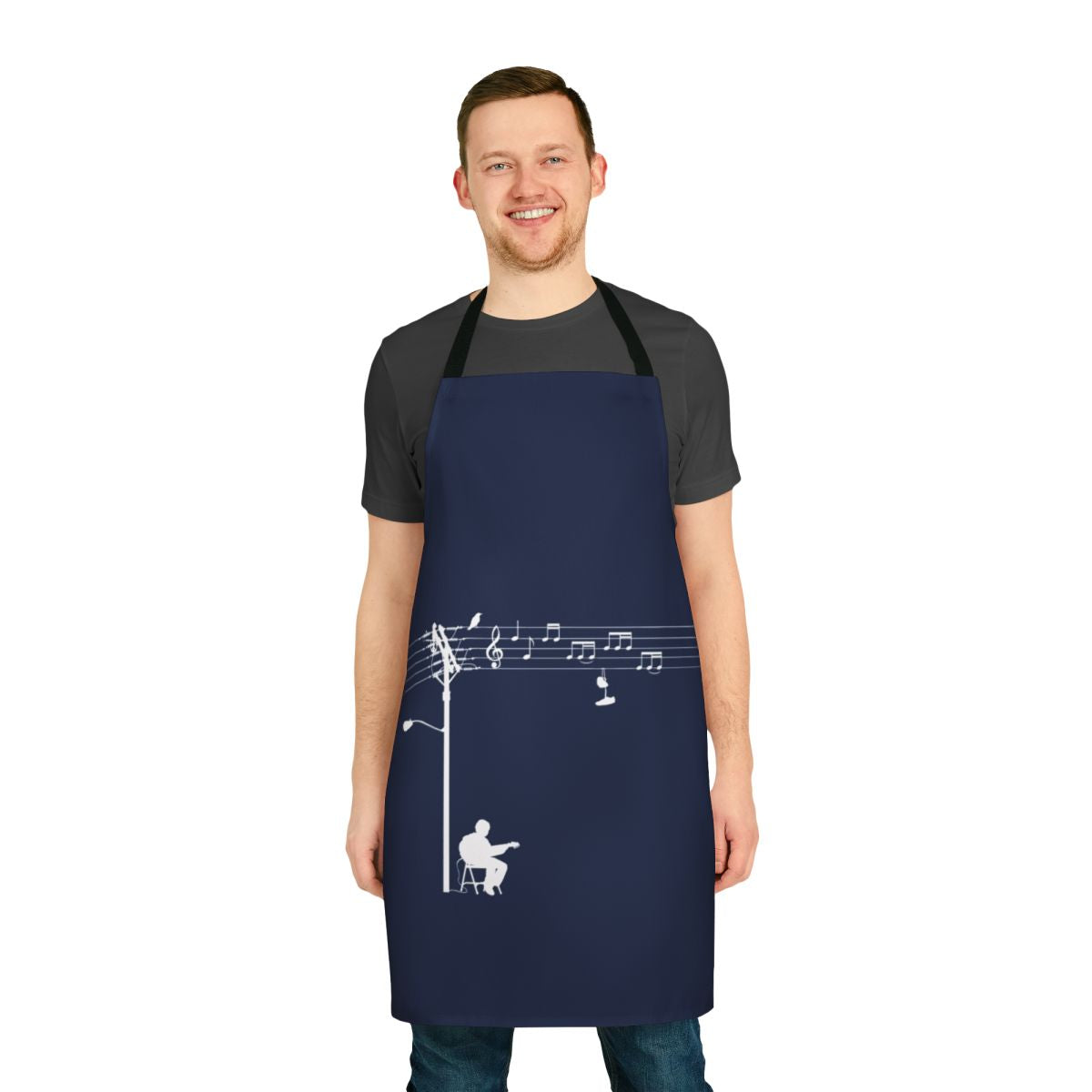 A white apron with a retro, funky design featuring musical elements like wires, sheet music, and a treble clef.
