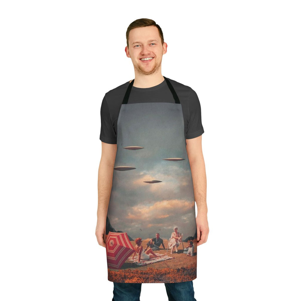 Vintage-inspired apron featuring a surreal digital collage of a retro-futuristic landscape with a floating spaceship, mountains, and a vibrant sky.