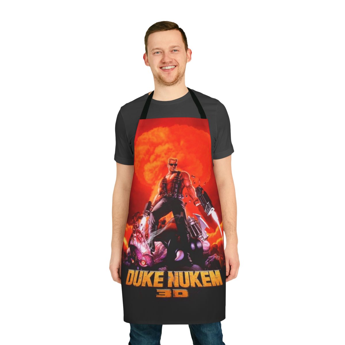Retro-style apron featuring bold, high-contrast artwork inspired by the classic Duke Nukem 3D first-person shooter game.