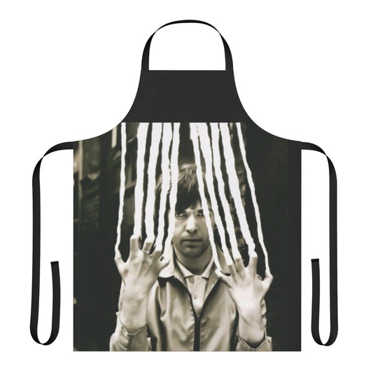 A vintage-style apron featuring a Genesis-inspired design with flute and scratchy elements, perfect for music fans.