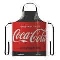 A vibrant red and white apron featuring a classic cola bottle design, perfect for the kitchen.