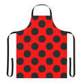 A red and black polka dot apron featuring a classic ladybug design