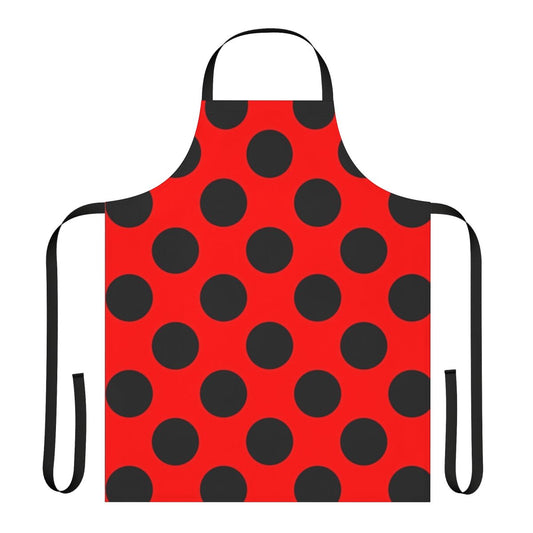 A red and black polka dot apron featuring a classic ladybug design