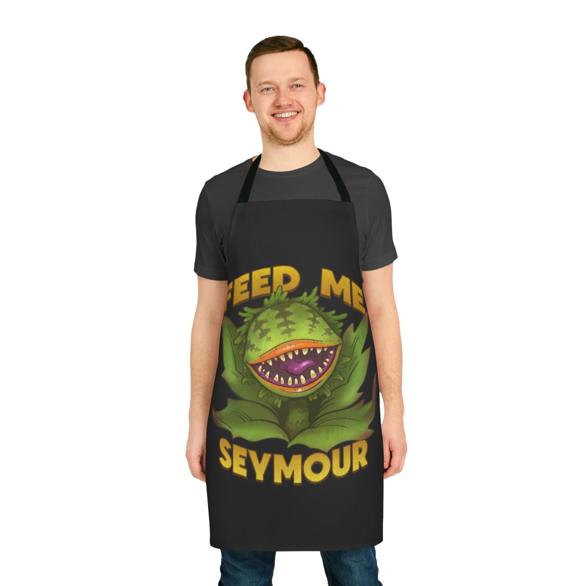 Vintage-style apron featuring the iconic Audrey II plant from the 1980s musical "Little Shop of Horrors"
