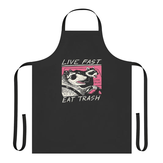 Retro-style apron with "Live Fast Eat Trash" design, featuring a raccoon graphic and 80s inspired elements