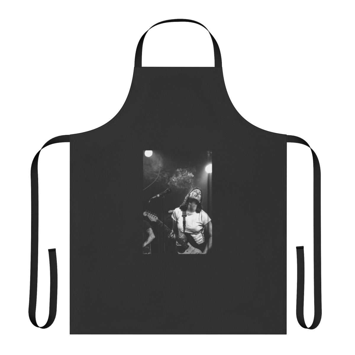 Black and white portrait of Kim Deal of The Breeders playing guitar, printed on a high-quality apron.