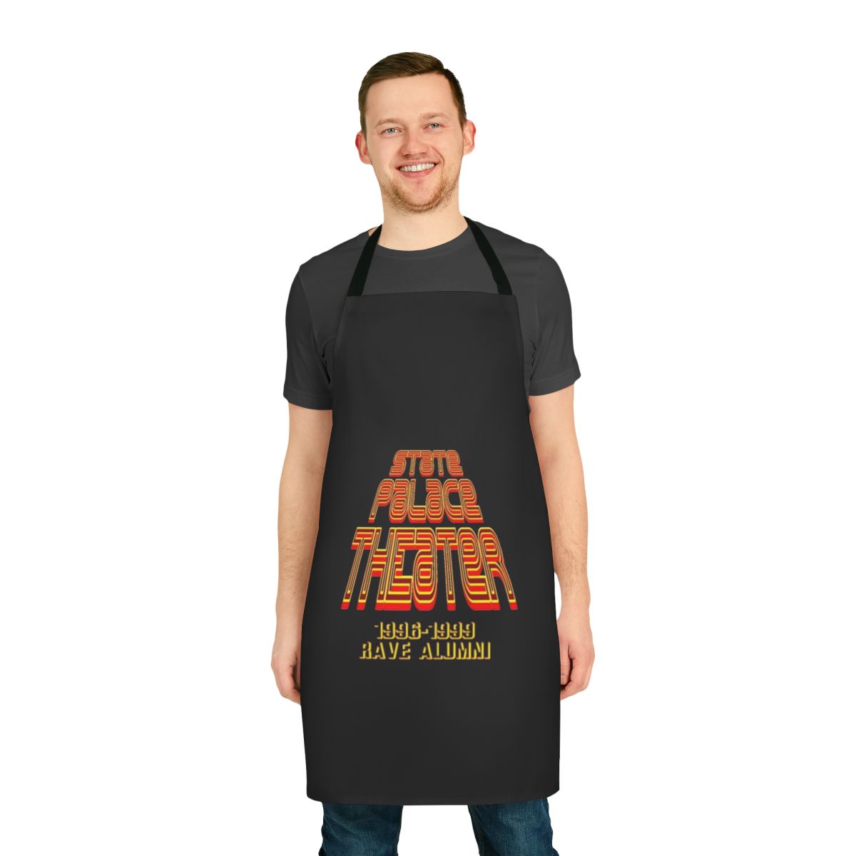 A white apron with a vibrant, retro-inspired design featuring the words "State Palace Theater" and rave-inspired graphics.