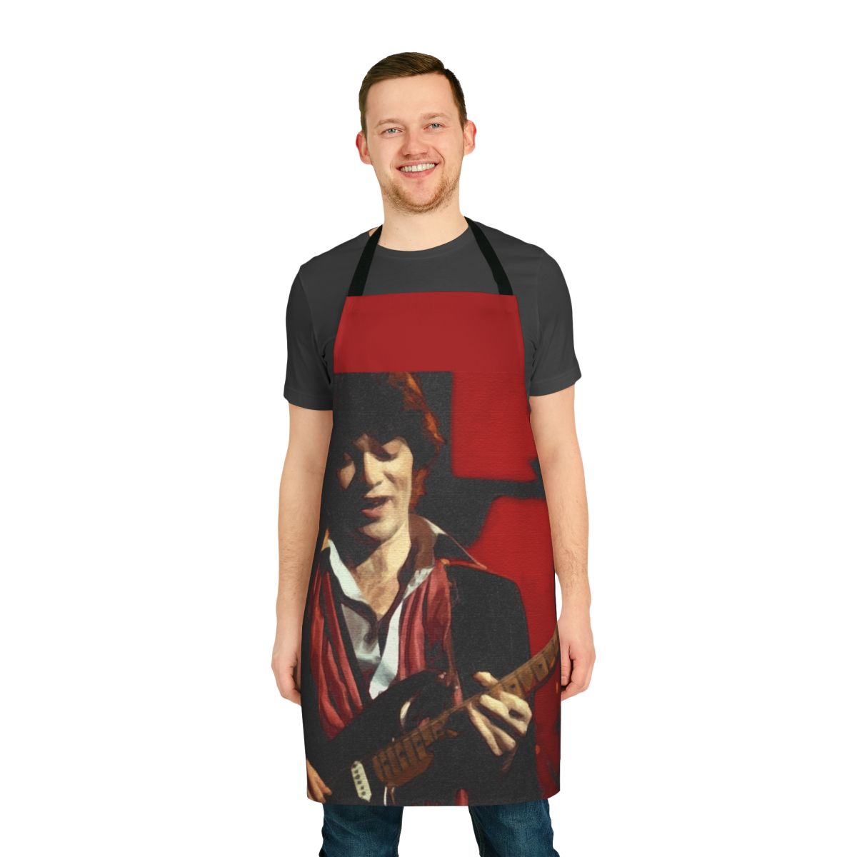 Red and black graphic apron featuring musician Robbie Robertson of the band The Band