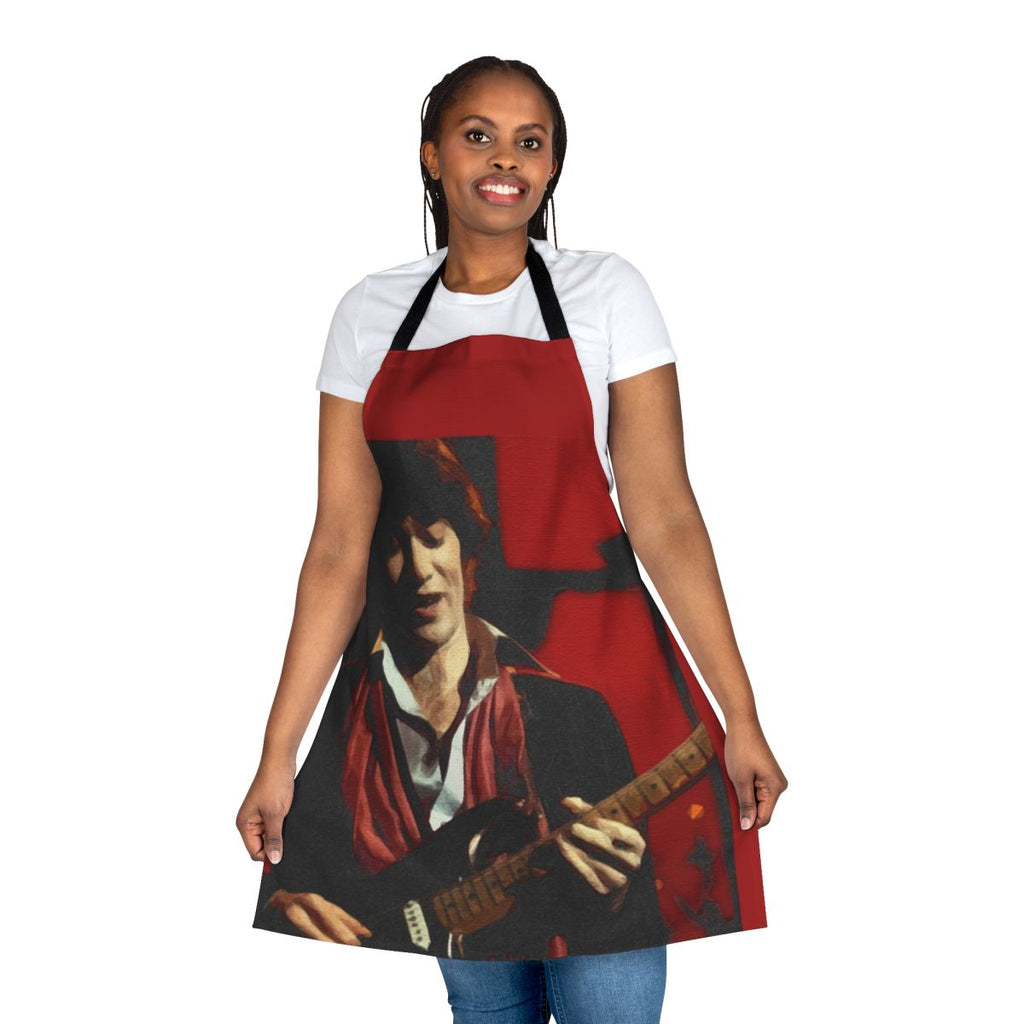 Red and black graphic apron featuring musician Robbie Robertson of the band The Band