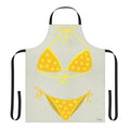 A cream-colored apron with a yellow polka dot pattern, inspired by classic swimsuit styles.