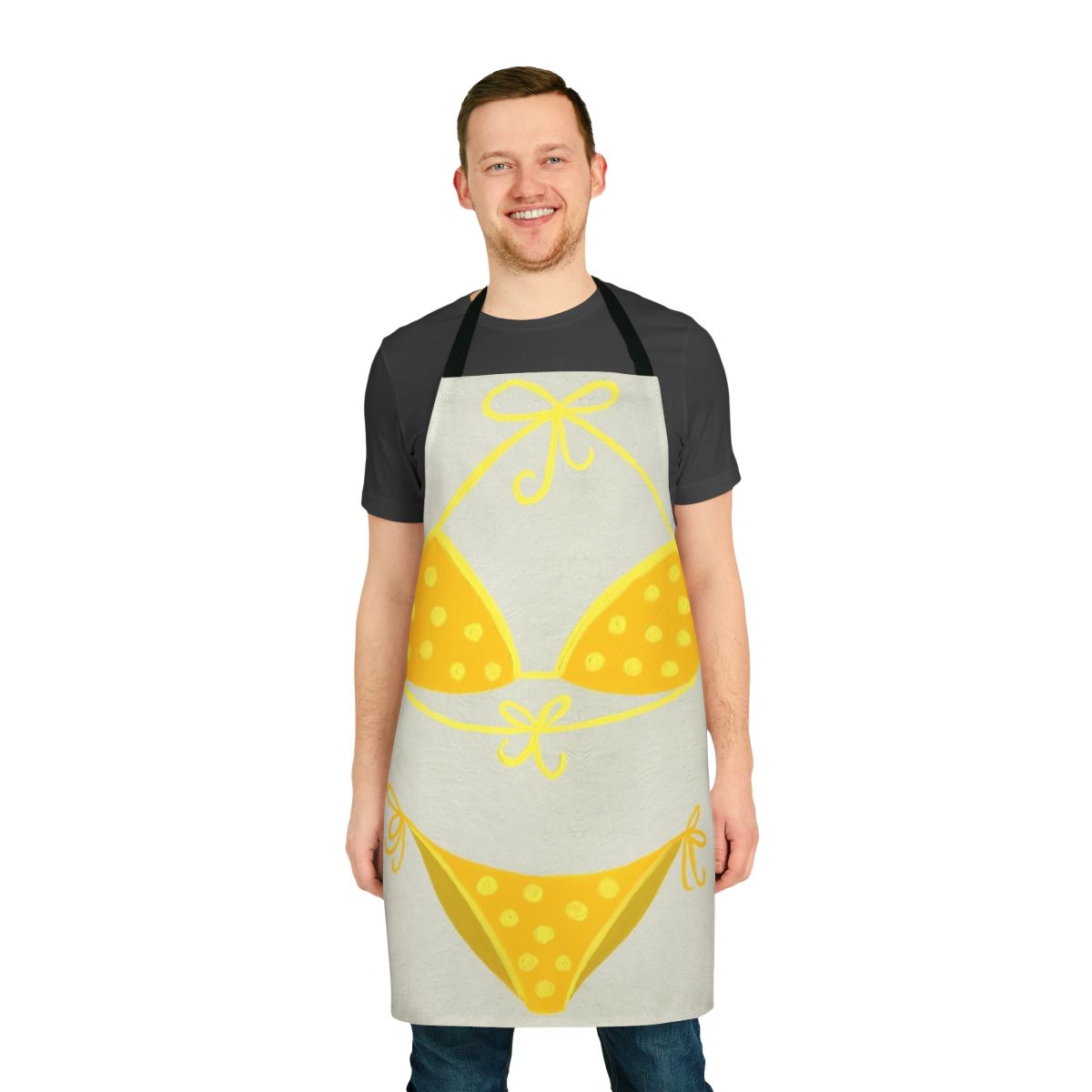 A cream-colored apron with a yellow polka dot pattern, inspired by classic swimsuit styles.