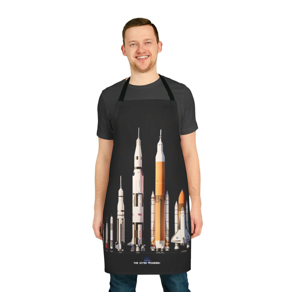 Apron with a black background featuring various NASA rockets and spaceships