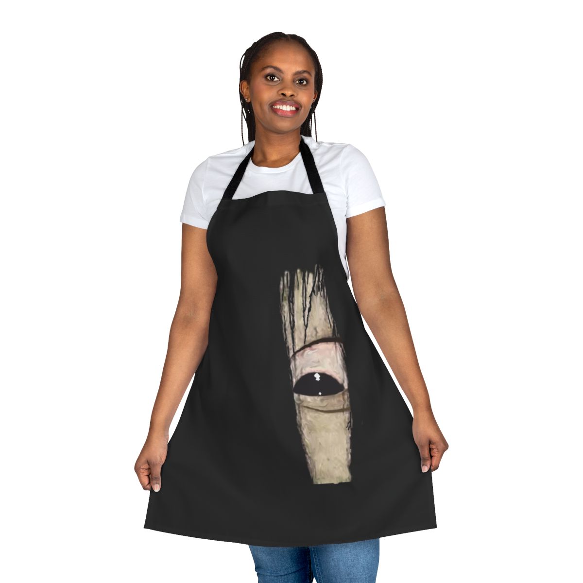 A black apron featuring an eerie close-up image of Sadako's eye, a classic horror movie icon.