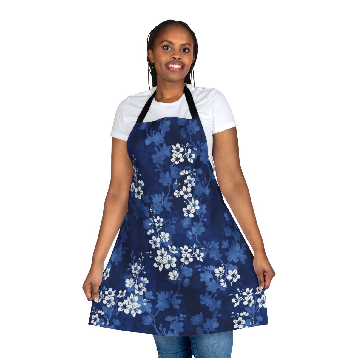 An apron featuring a watercolor pattern of sakura blossoms and swallowtail butterflies in shades of blue.
