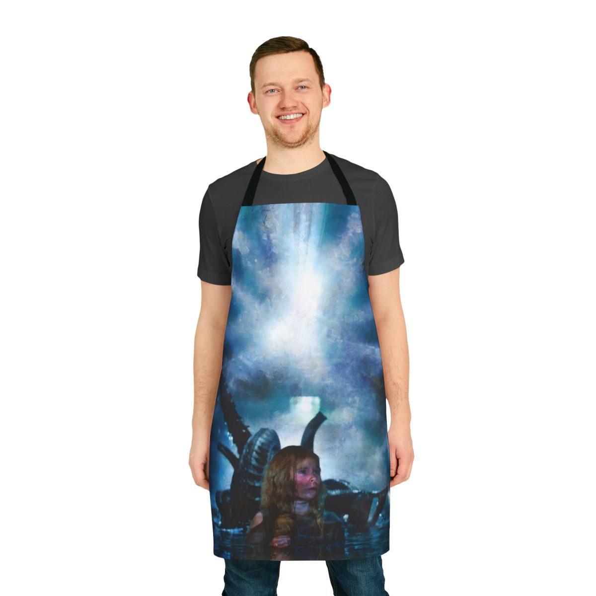 Person wearing an apron featuring a Newt character from the sci-fi movie Aliens
