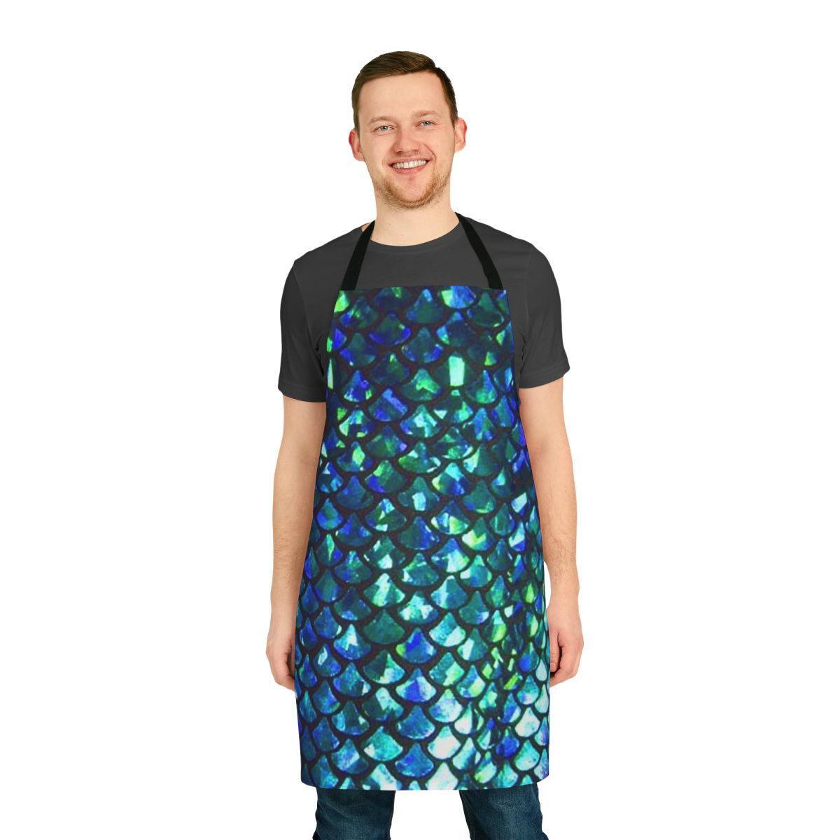 Woman wearing a turquoise and shimmery apron with a mermaid fish scale design