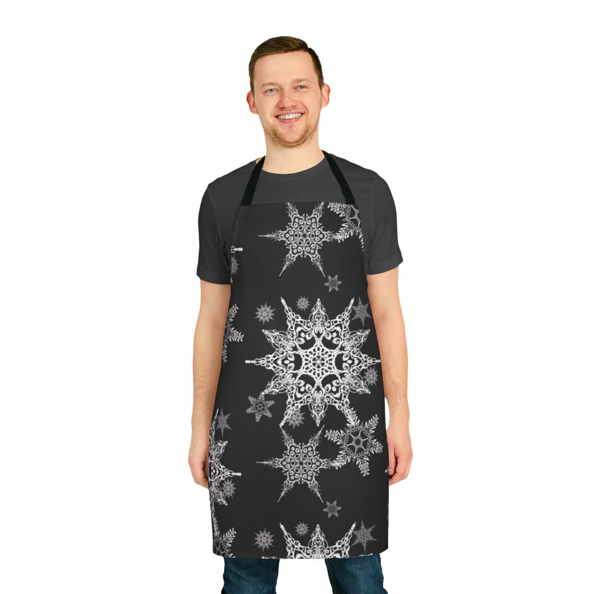 Skull-patterned snowflakes on a black apron, perfect for goth or winter holiday celebrations