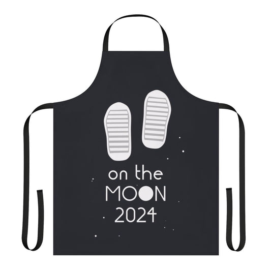 A white apron with the text 'Boots On The Moon 2024' and a moon graphic, referencing the popular space force tv show.