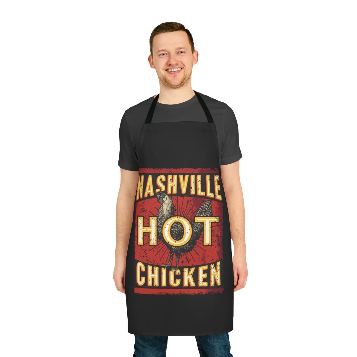 A vibrant red and white apron featuring the words "Nashville Hot Chicken"