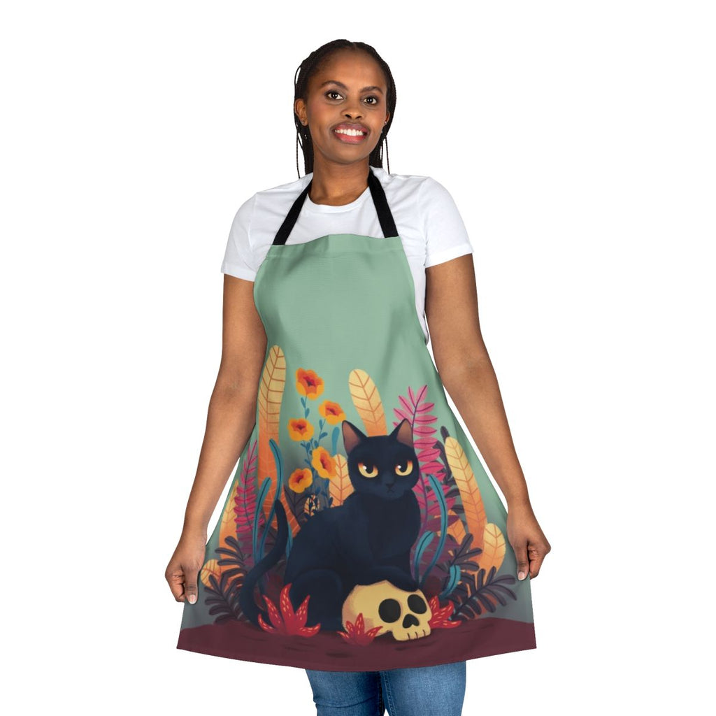 An apron featuring a cute and spooky skull cat design with floral and autumn elements.