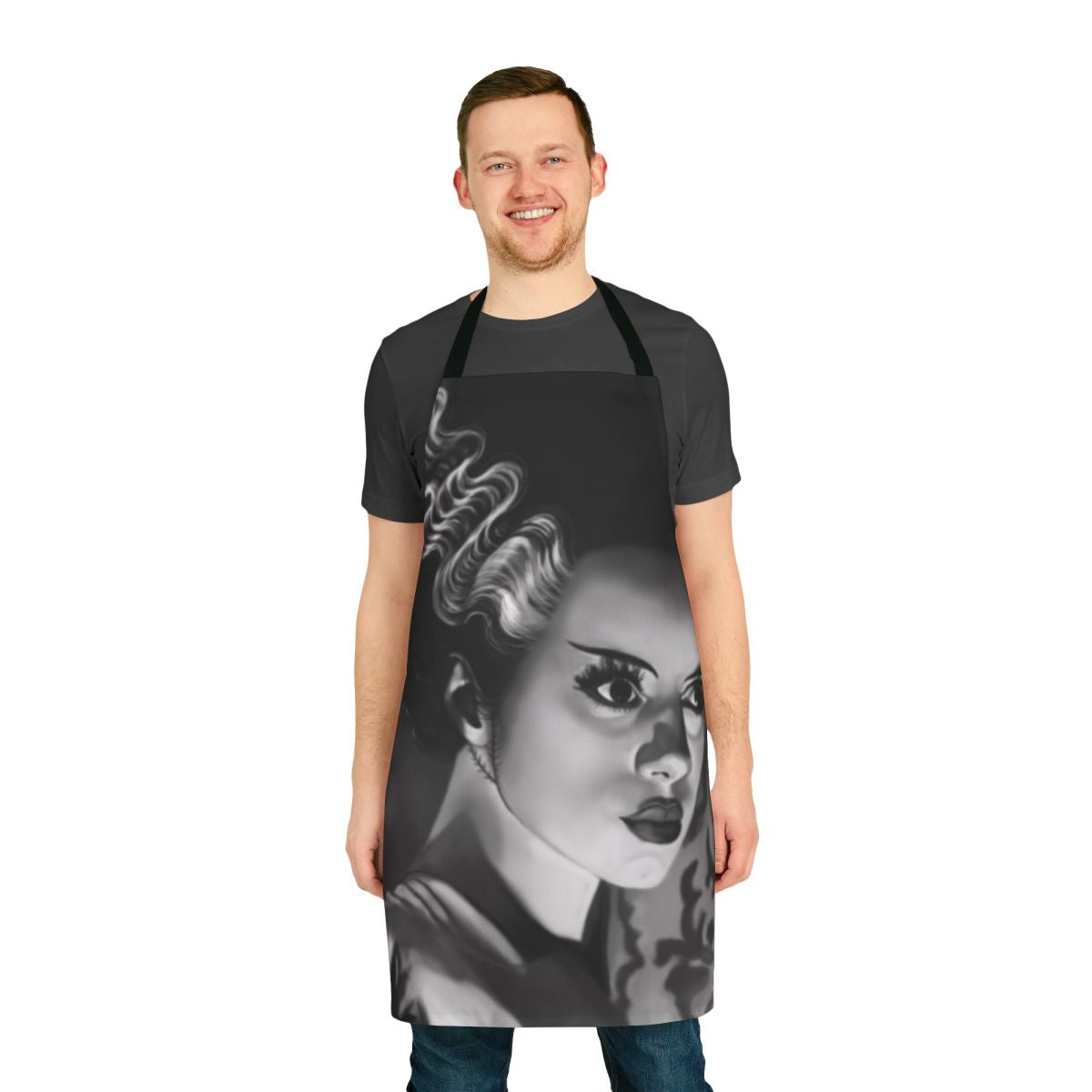 A white apron featuring a bride-inspired design with gothic and horror-themed elements, perfect for fans of classic monster movies.