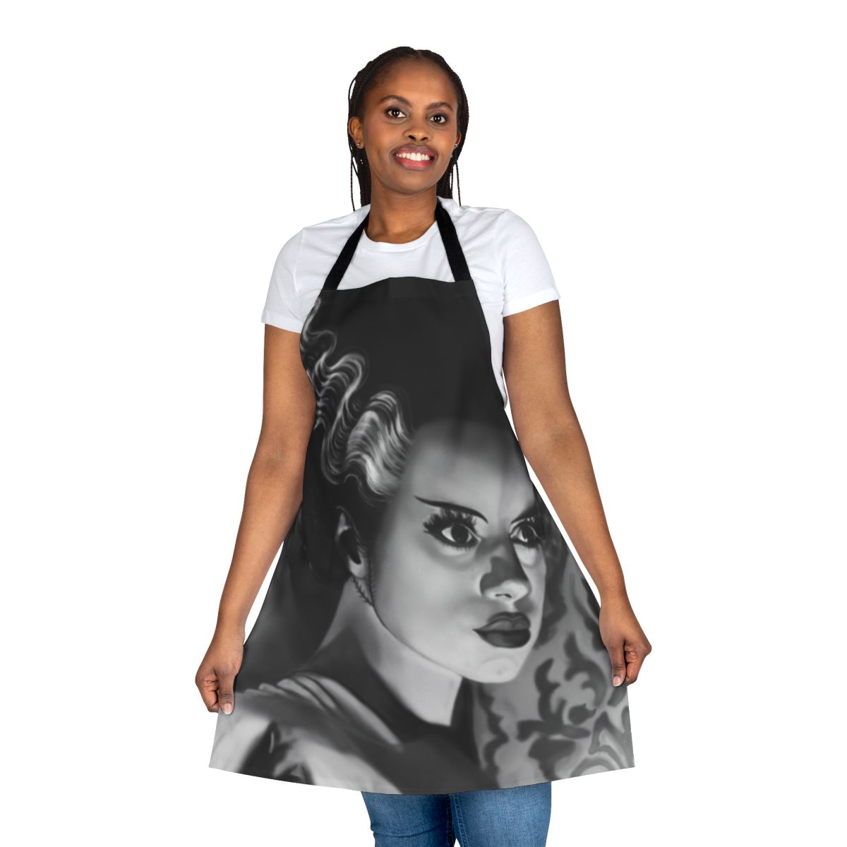 A white apron featuring a bride-inspired design with gothic and horror-themed elements, perfect for fans of classic monster movies.
