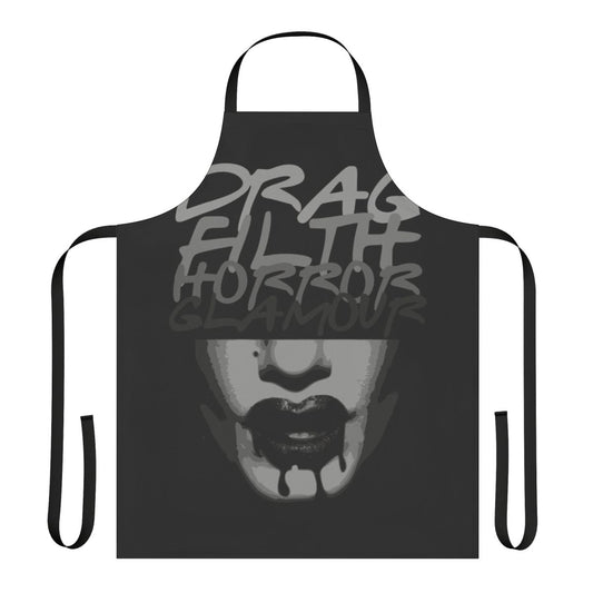 A spooky and glamorous apron featuring horror-inspired designs, perfect for drag enthusiasts and Halloween celebrations.