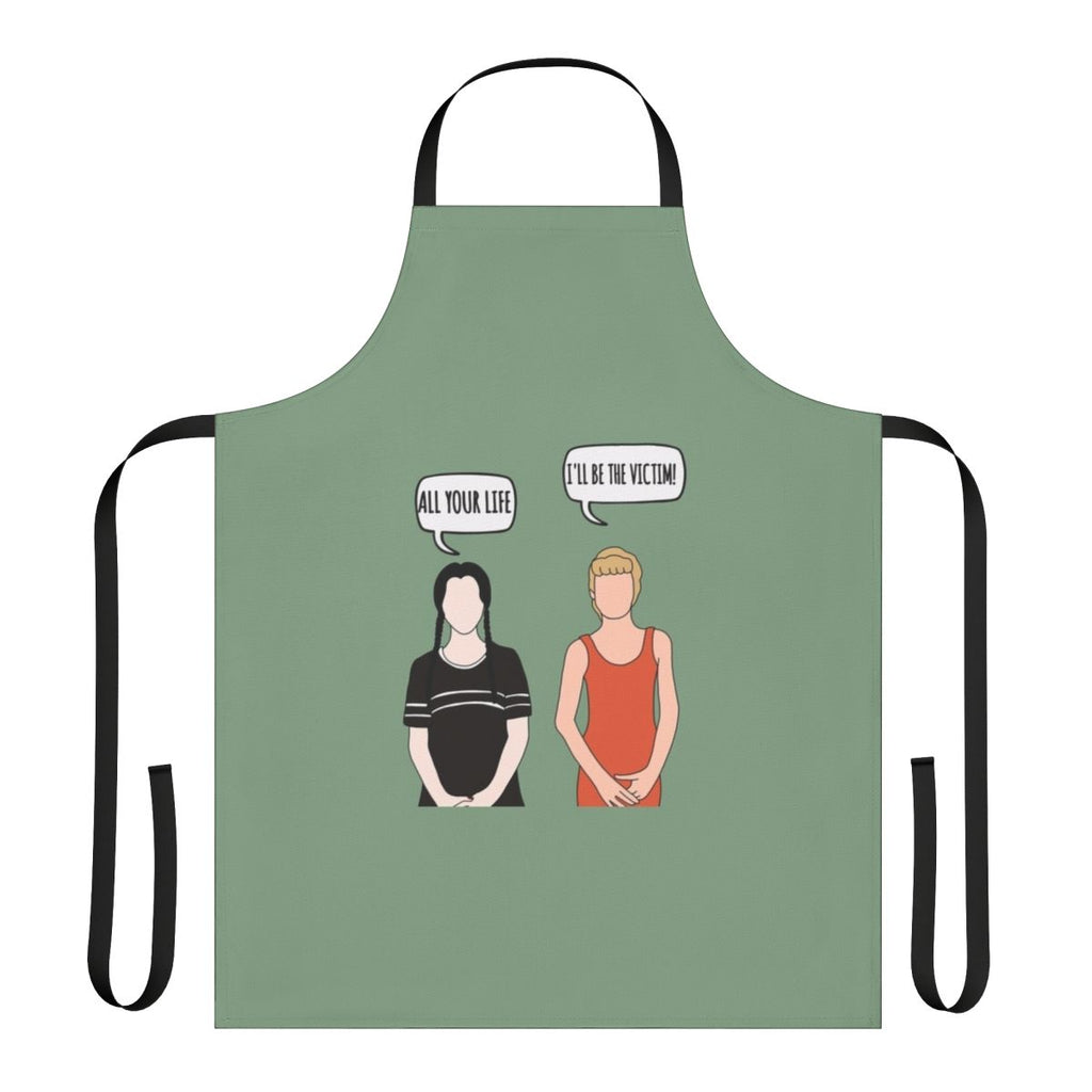 A black apron with a spooky "I'll Be the Victim" design, inspired by the Addams Family