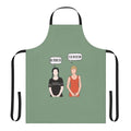 A black apron with a spooky "I'll Be the Victim" design, inspired by the Addams Family
