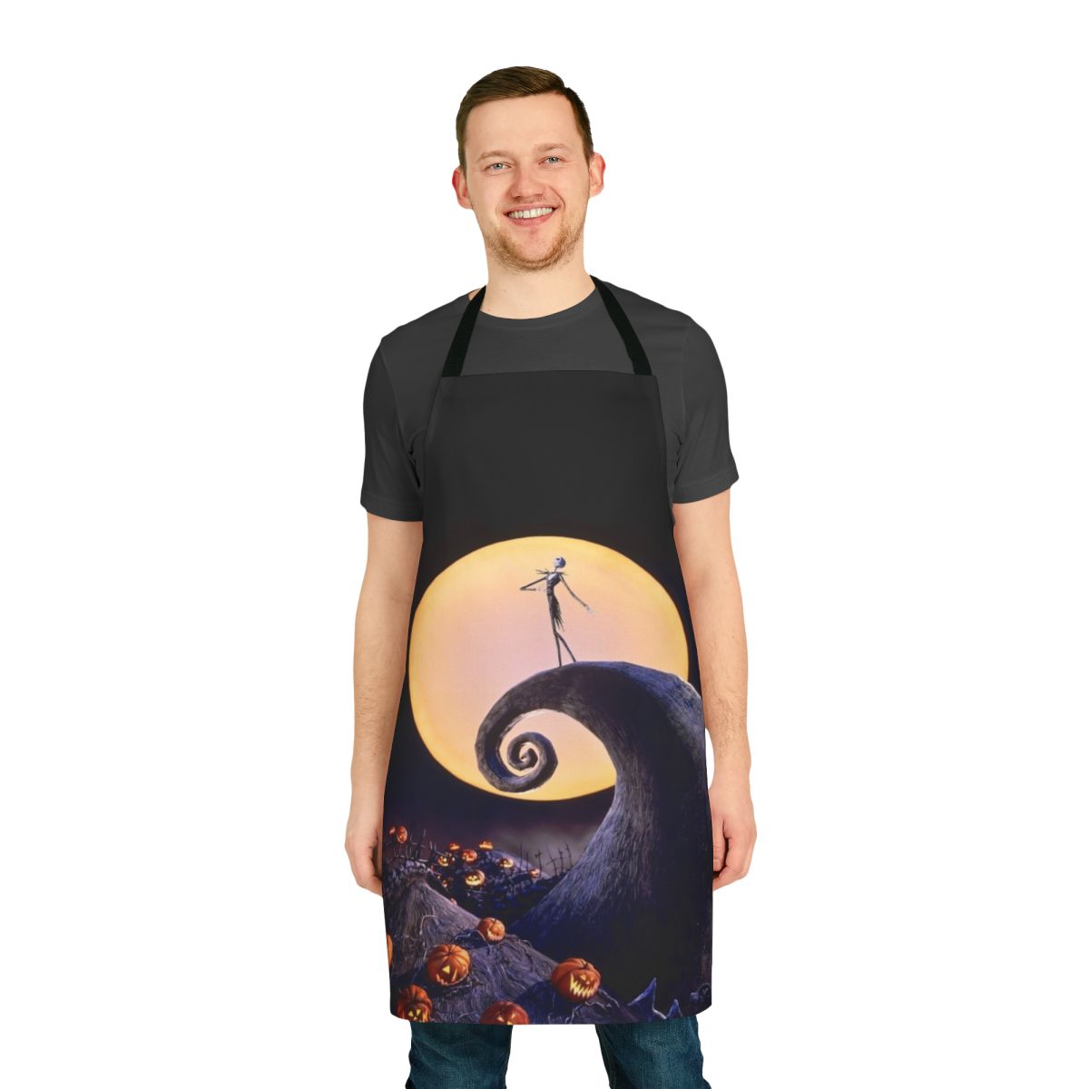 A black apron featuring the iconic characters and imagery from The Nightmare Before Christmas.
