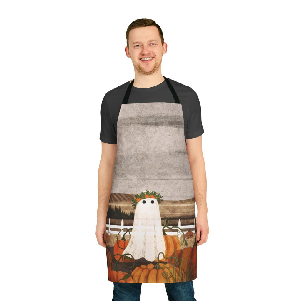 A vintage-style apron with a ghostly pumpkin patch design, perfect for fall and Halloween celebrations.