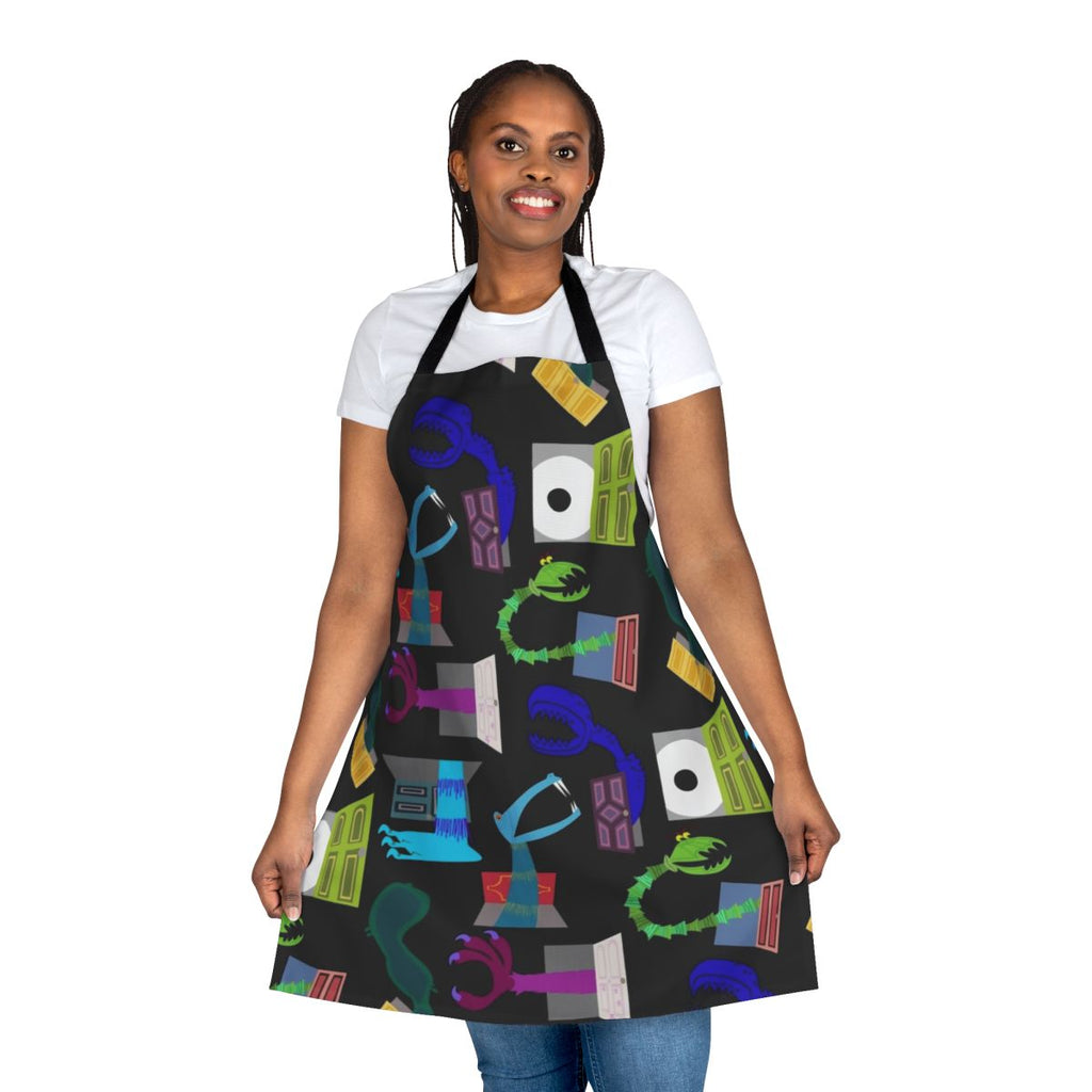 "Apron featuring characters from the Monsters Inc. movie, including Sully and Mike Wazowski"