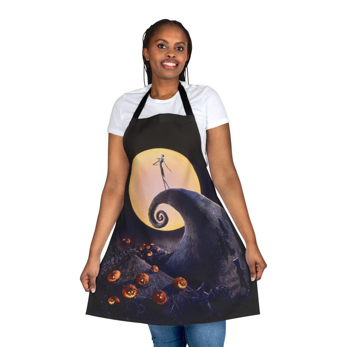 A black apron with a pumpkin skull design, inspired by the classic Tim Burton film The Nightmare Before Christmas.