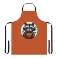 A cartoon raccoon apron with pumpkins, bats, and a jack o' lantern design, perfect for Halloween and fall festivities.
