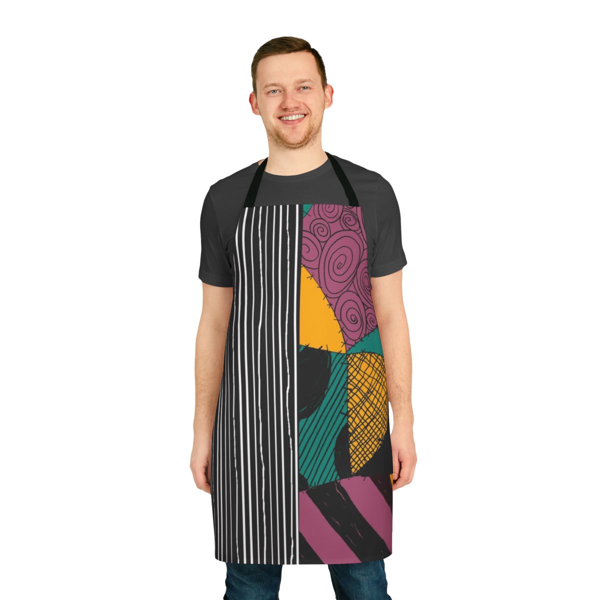 A black and white apron with Jack Skellington and Sally from The Nightmare Before Christmas design