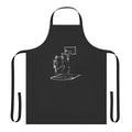 A black and white apron featuring a skeleton basketball player design.