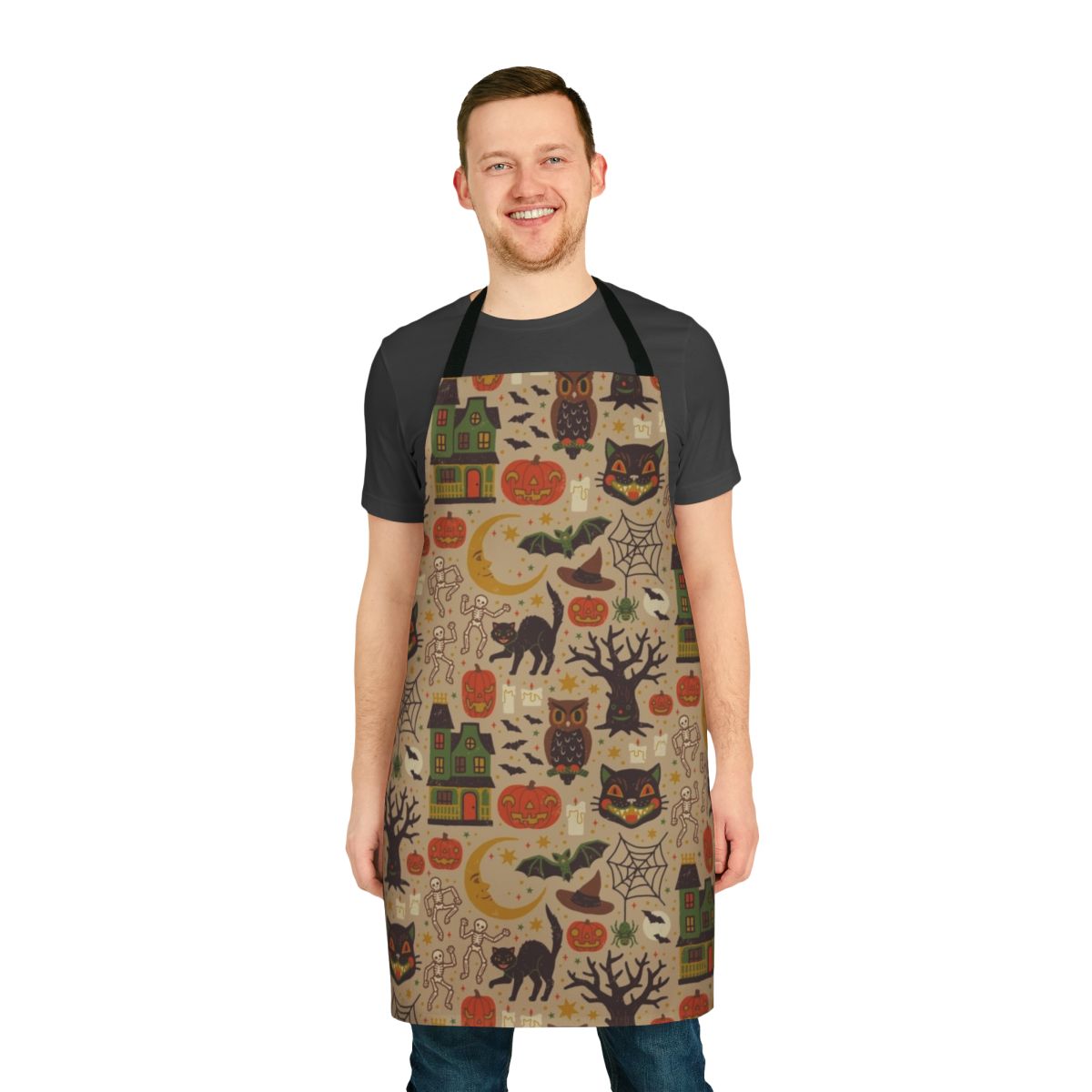 Vintage-inspired Halloween apron with black cats, pumpkins, owls, and other spooky motifs