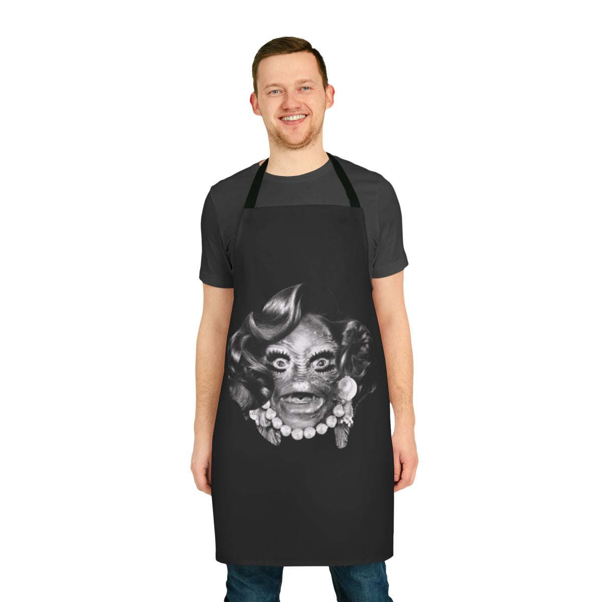 Spooky vintage-inspired apron featuring classic horror monsters like Dracula, Wolfman, and Zombie