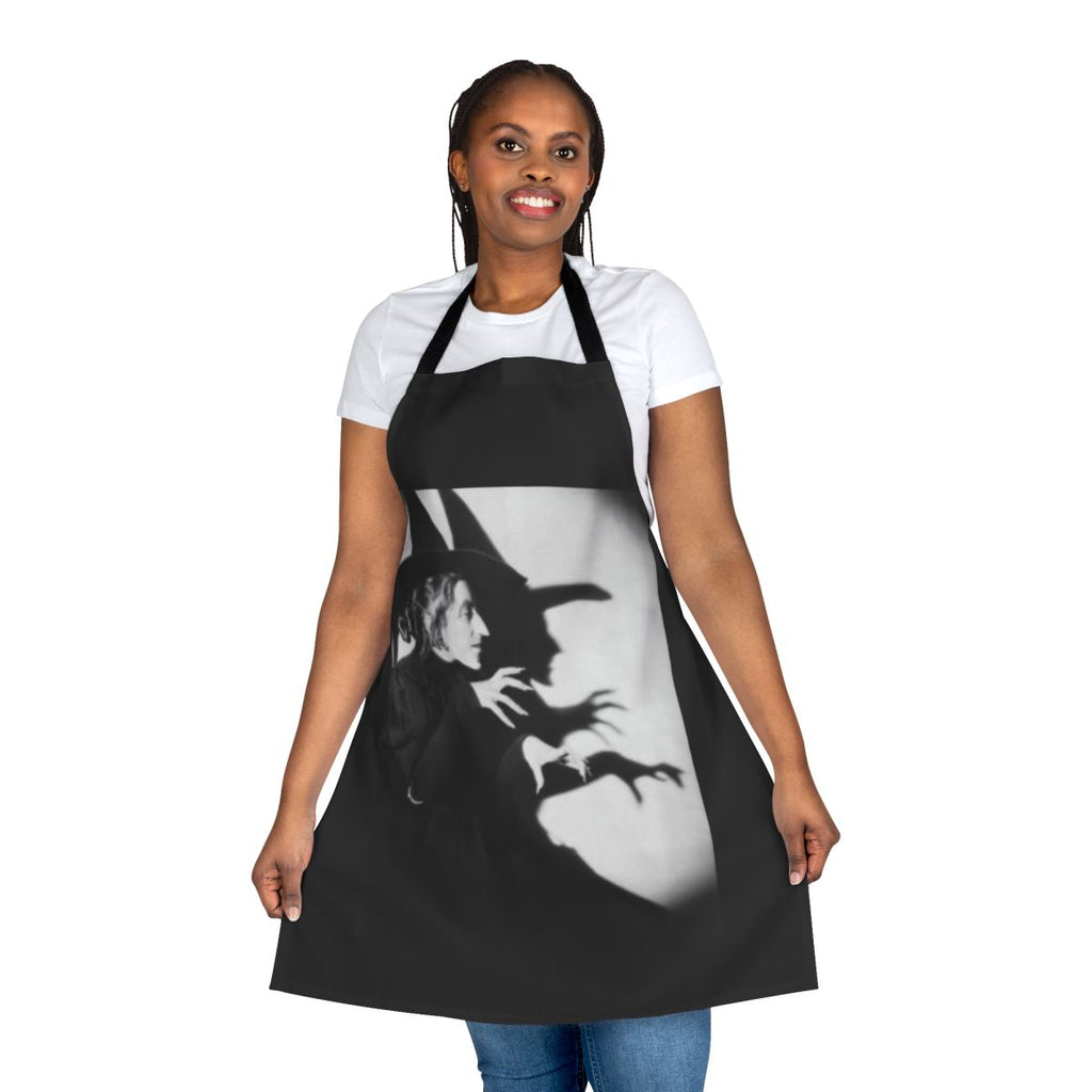 Spooky witch-themed apron with black and green design