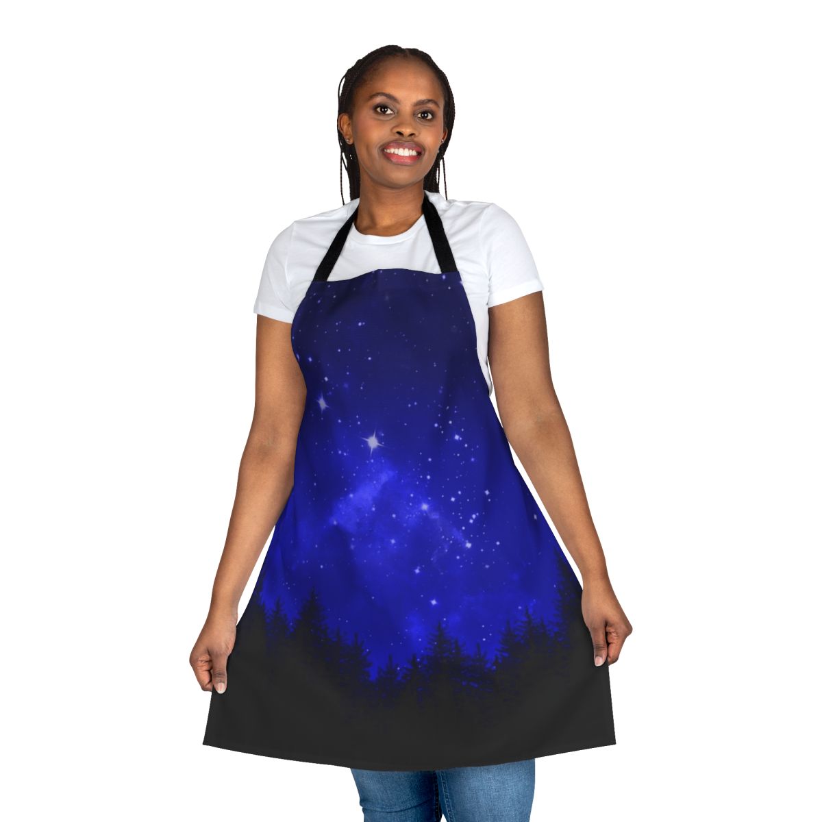 Apron featuring a blue galaxy forest night sky design with silhouettes of trees, mountains, and the moon.
