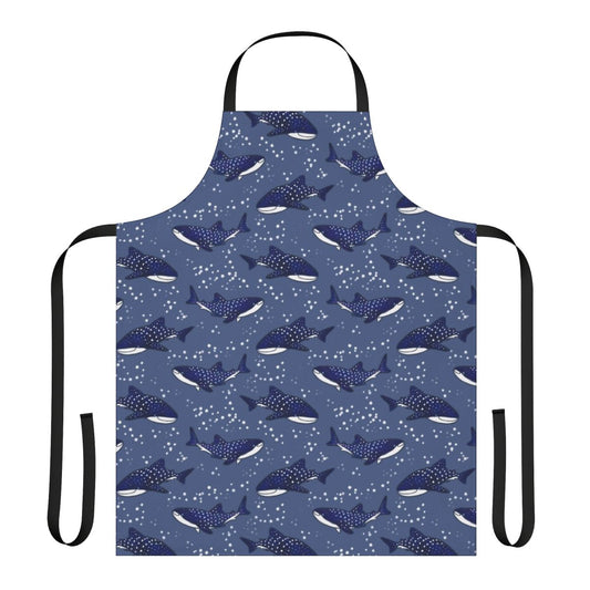 A dark blue apron featuring a starry night sky design with a cartoon whale shark