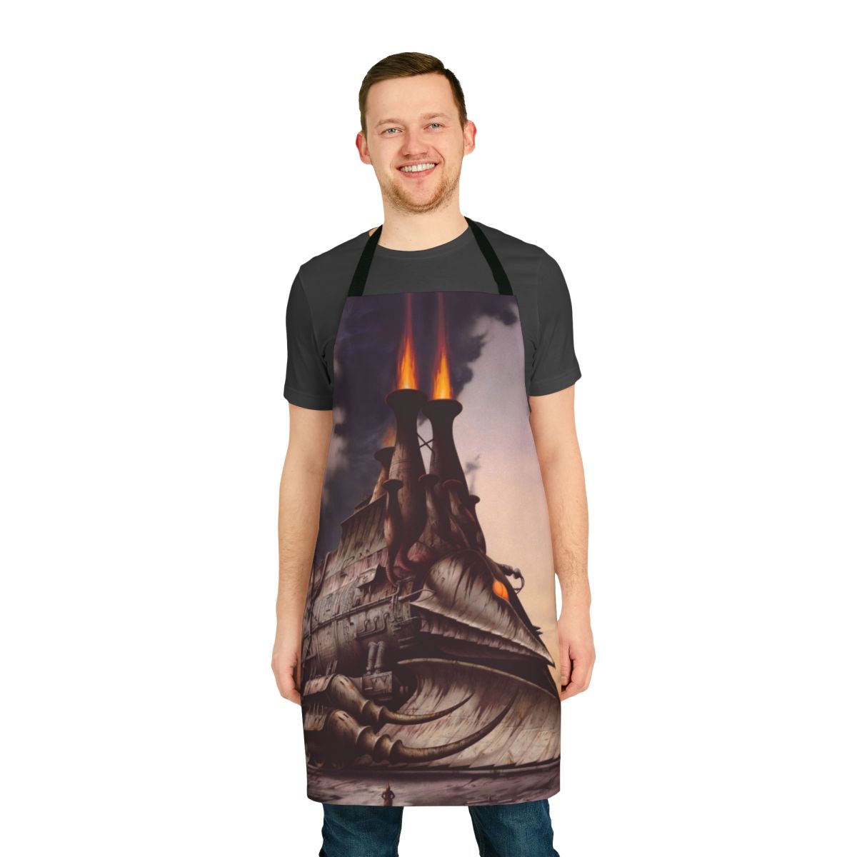 A steampunk-styled apron with a heavy metal-inspired fantasy design featuring a locomotive and Rodney Matthews-inspired artwork.